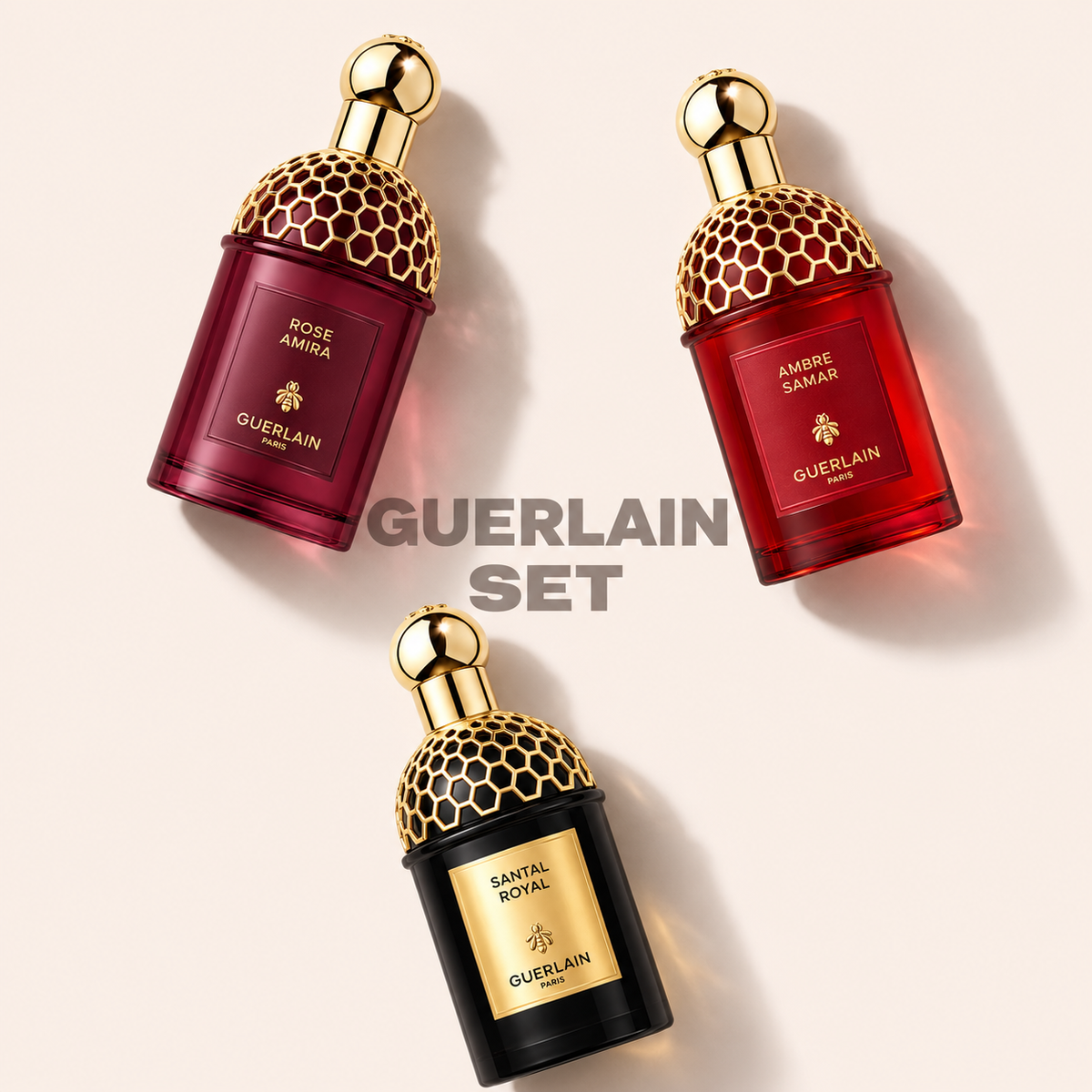 Guerlain set – unisex – součásti parfémového setu na jednotném světlém pozadí – MrRizz