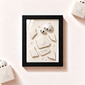 Parfemovy obraz Amouage Love Tuberose v cernem ramu - ilustracni fotografie