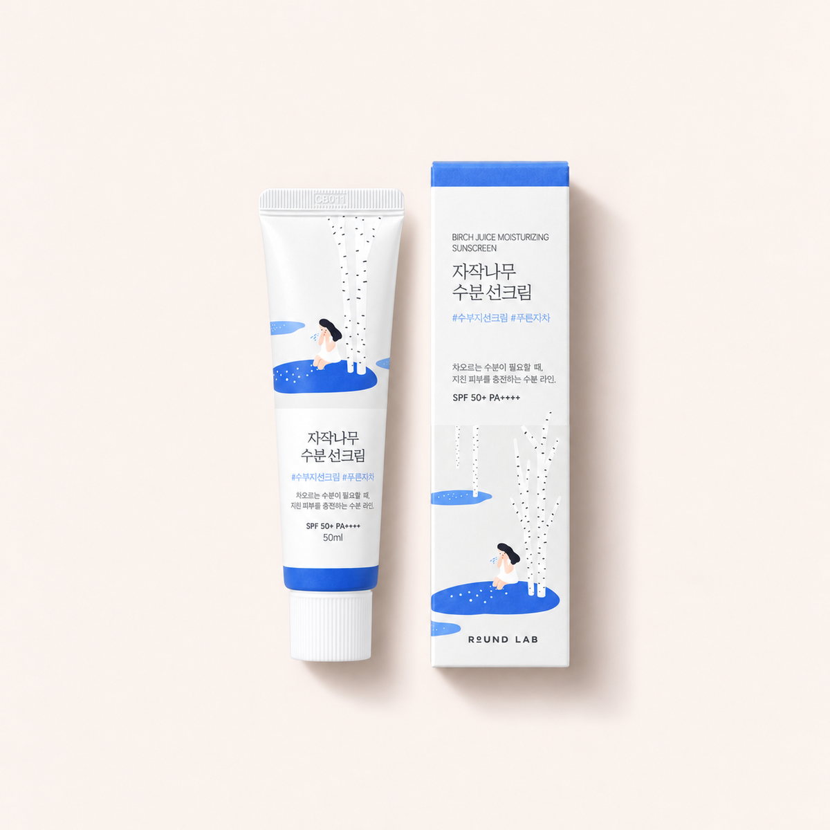 Round Lab Birch Juice Moisturizing Sunscreen 50 ml – výrobek s odpovídajícím obalem vleže – MrRizz